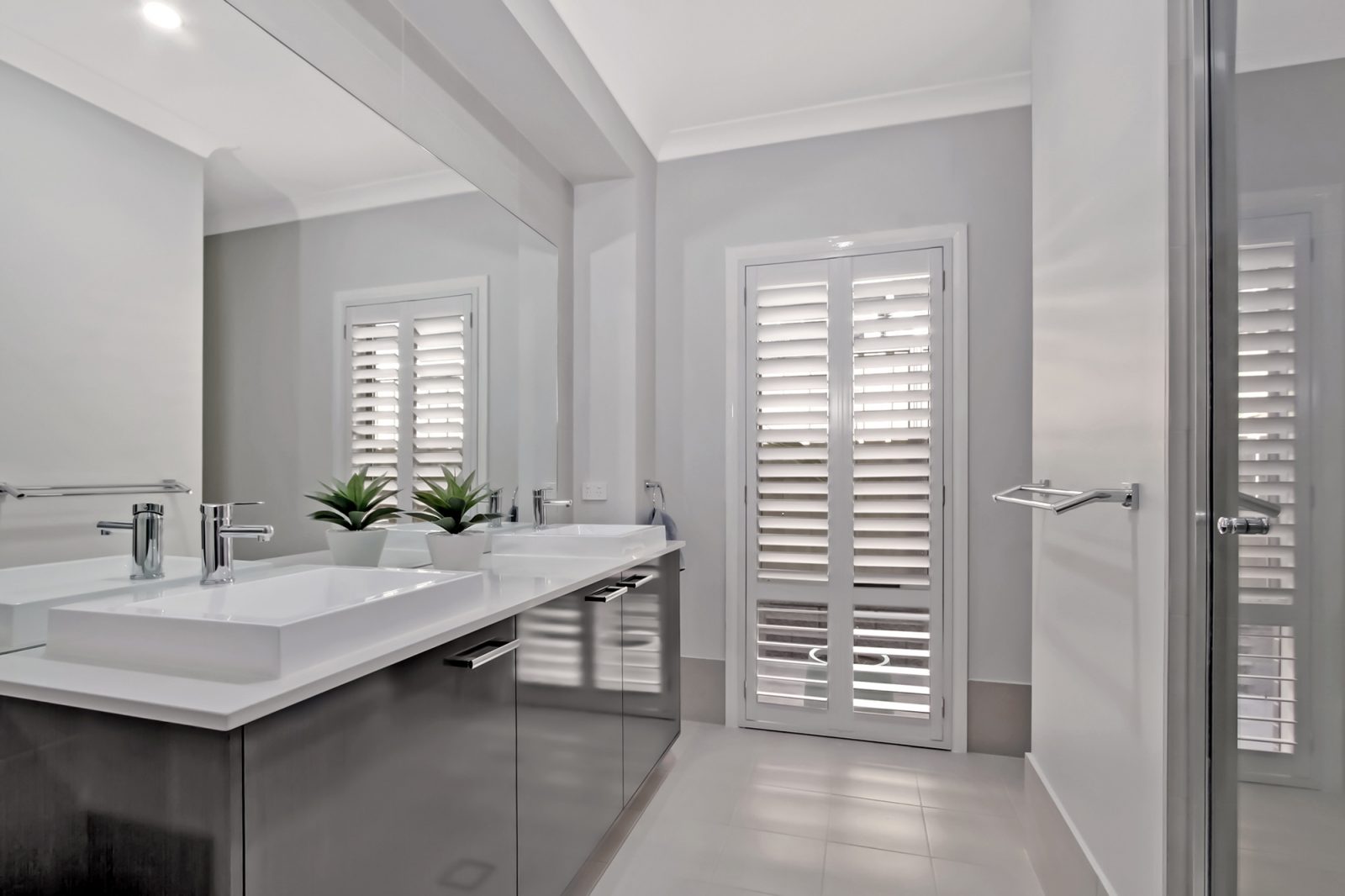Why You Should Team Your Plantation Shutters With Curtains